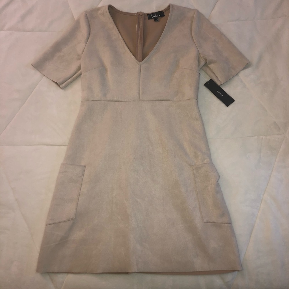 Tan/cream color dress.